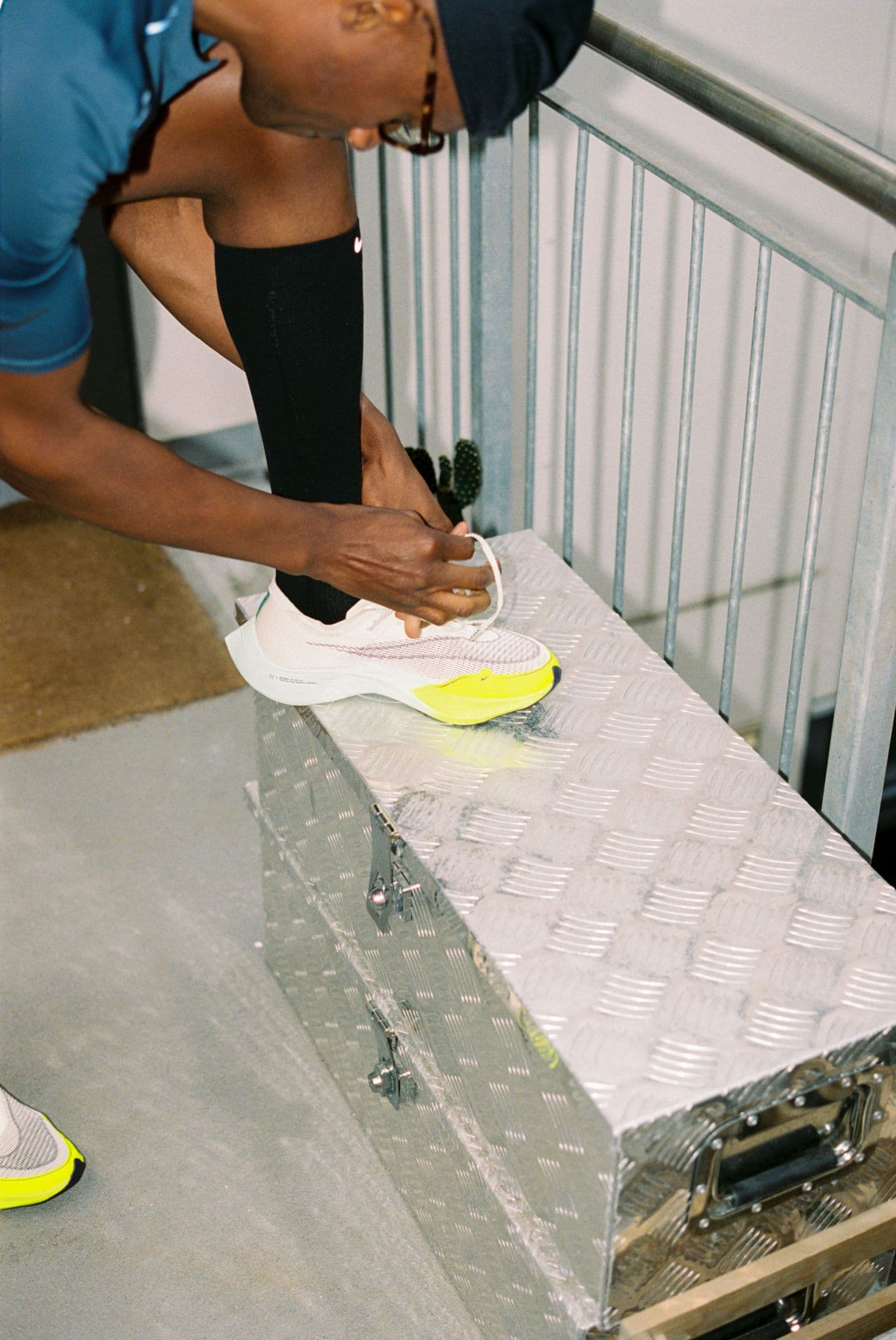 A man tying his shoes